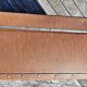 Brown vintage suitcase with CHENEY England brand travel tags