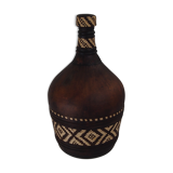 Old bottle in leather