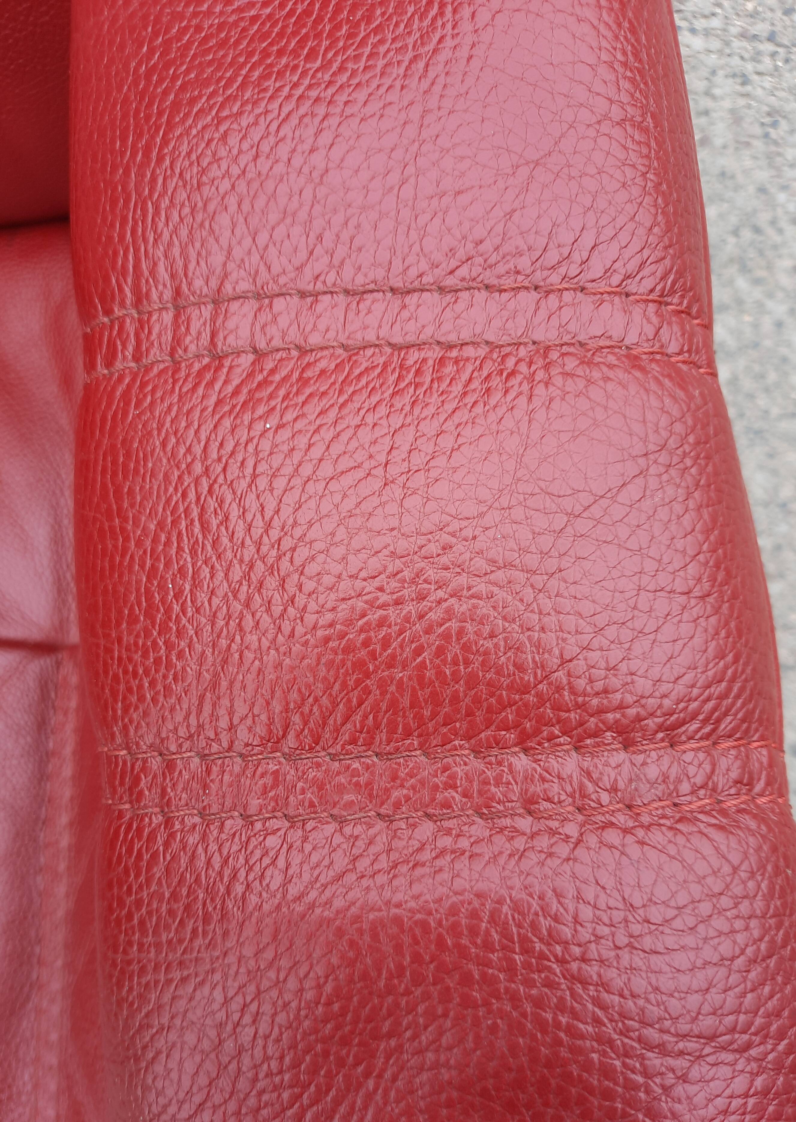Red leather relax armchair and pouf