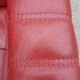 Red leather relax armchair and pouf