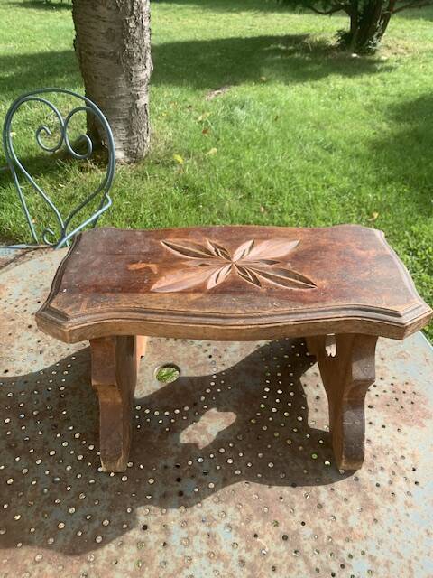 Bench in carved and varnished wood, mountain chalet decoration, old