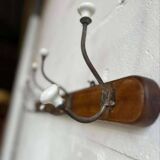 Vintage industrial wooden coat rack with porcelain hooks