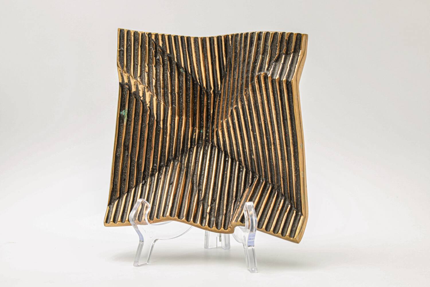 Brutalist bronze pocket emptier