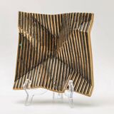 Brutalist bronze pocket emptier