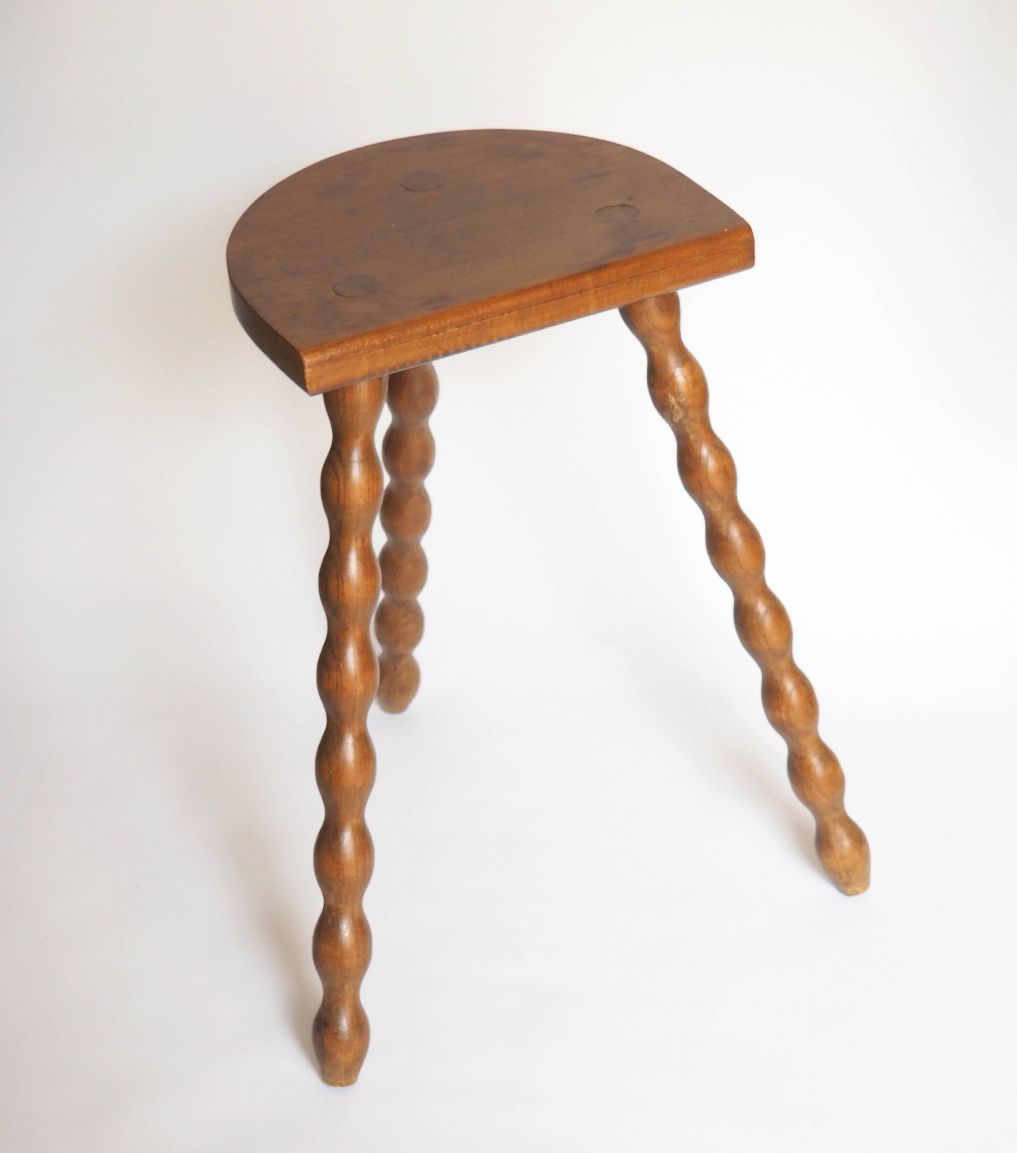 High tripod stool in turned wood