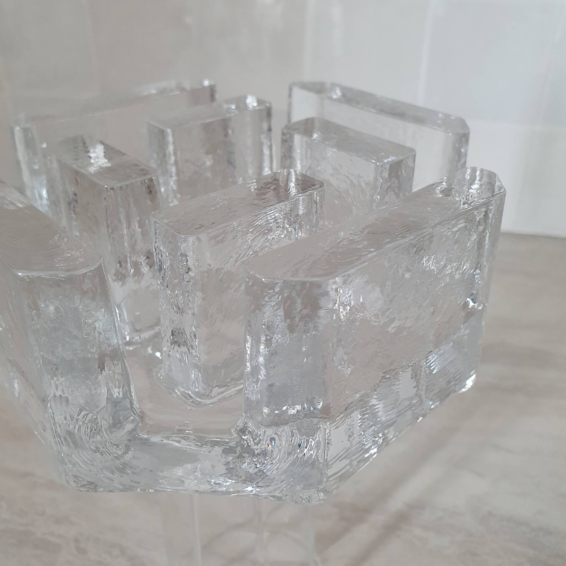 Candle holder or glass warmer with irregular ice effect.