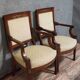 Pair of Empire period armchairs, in mahogany and gilded bronze.