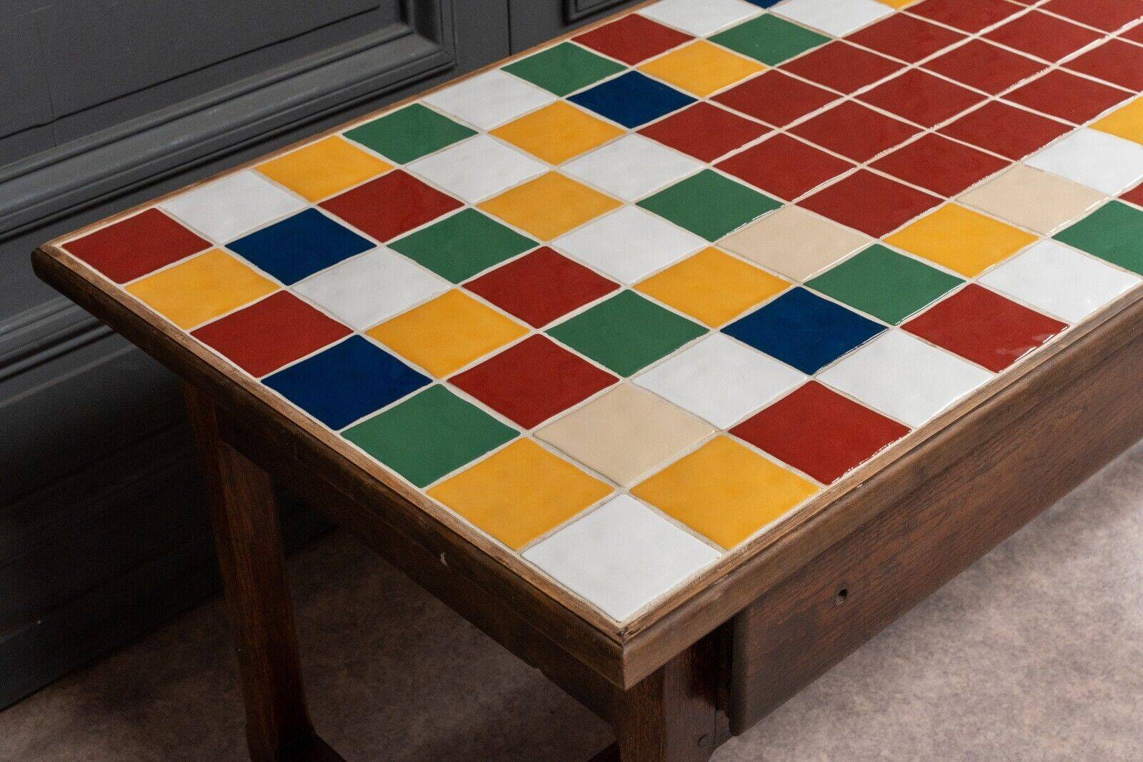 19th century oak farm table with multi-colored ceramic tiles