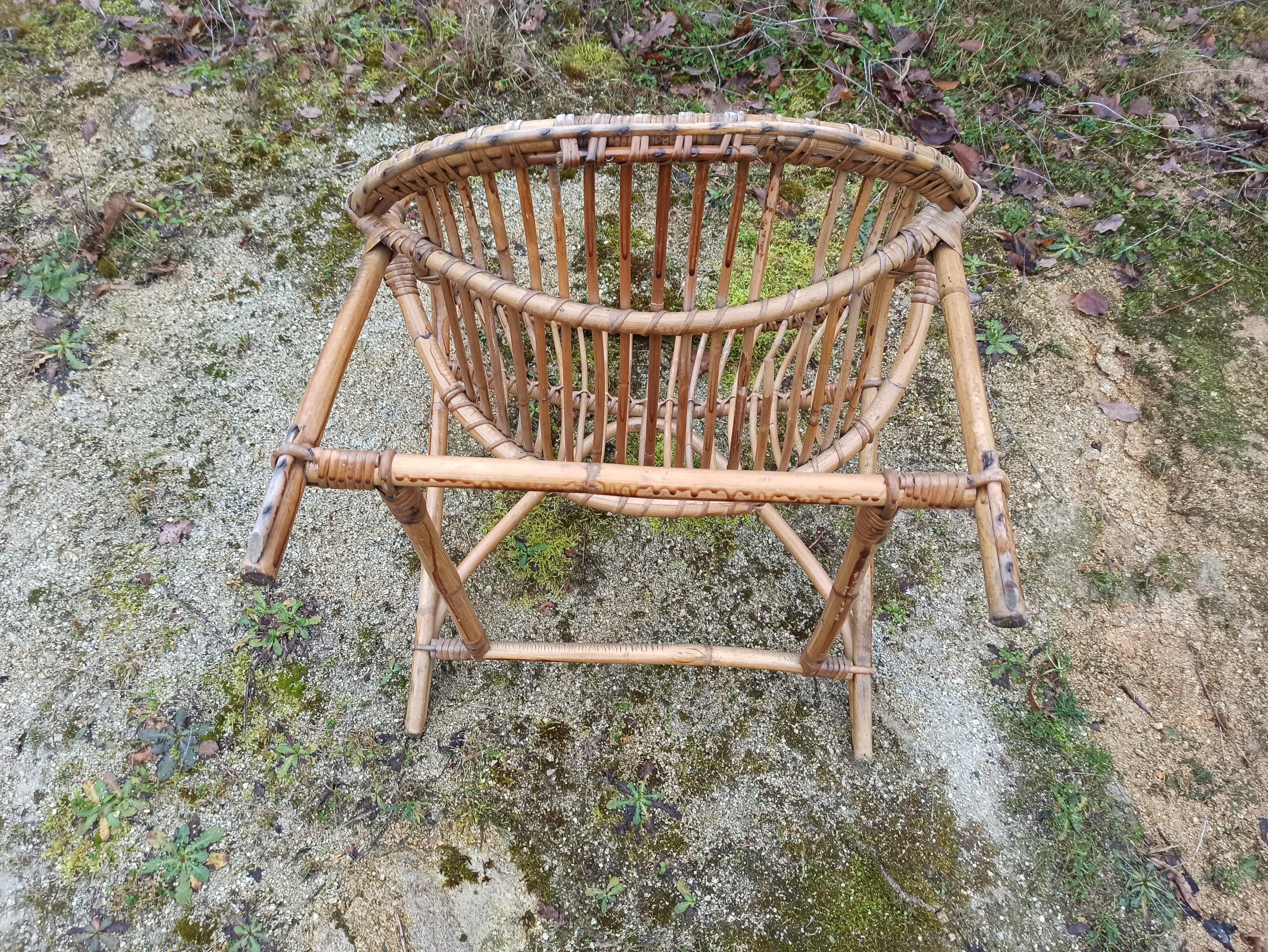 Rattan armchair with armrest