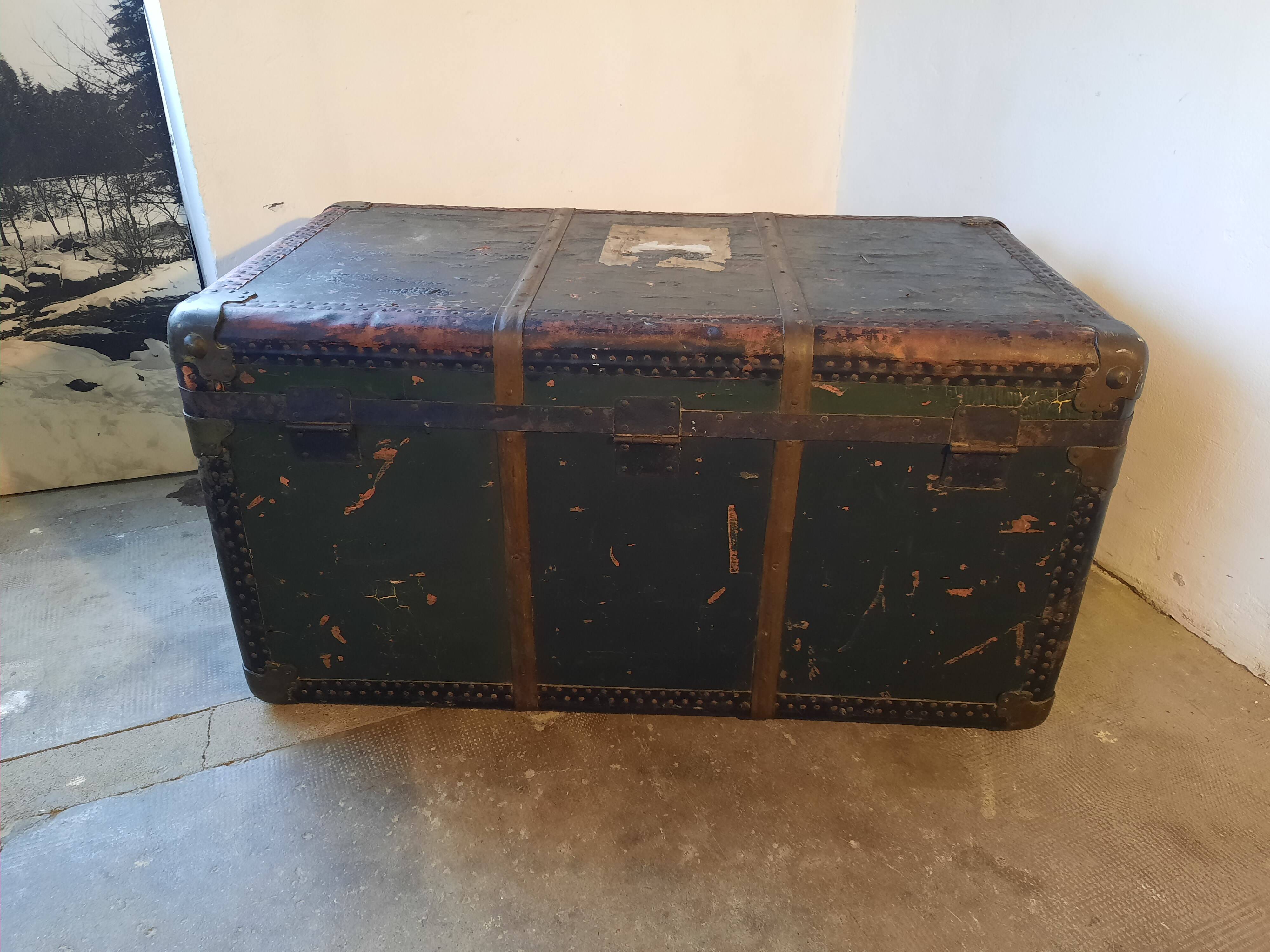 Old and large travel trunk, brass-plated corners
