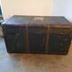 Old and large travel trunk, brass-plated corners