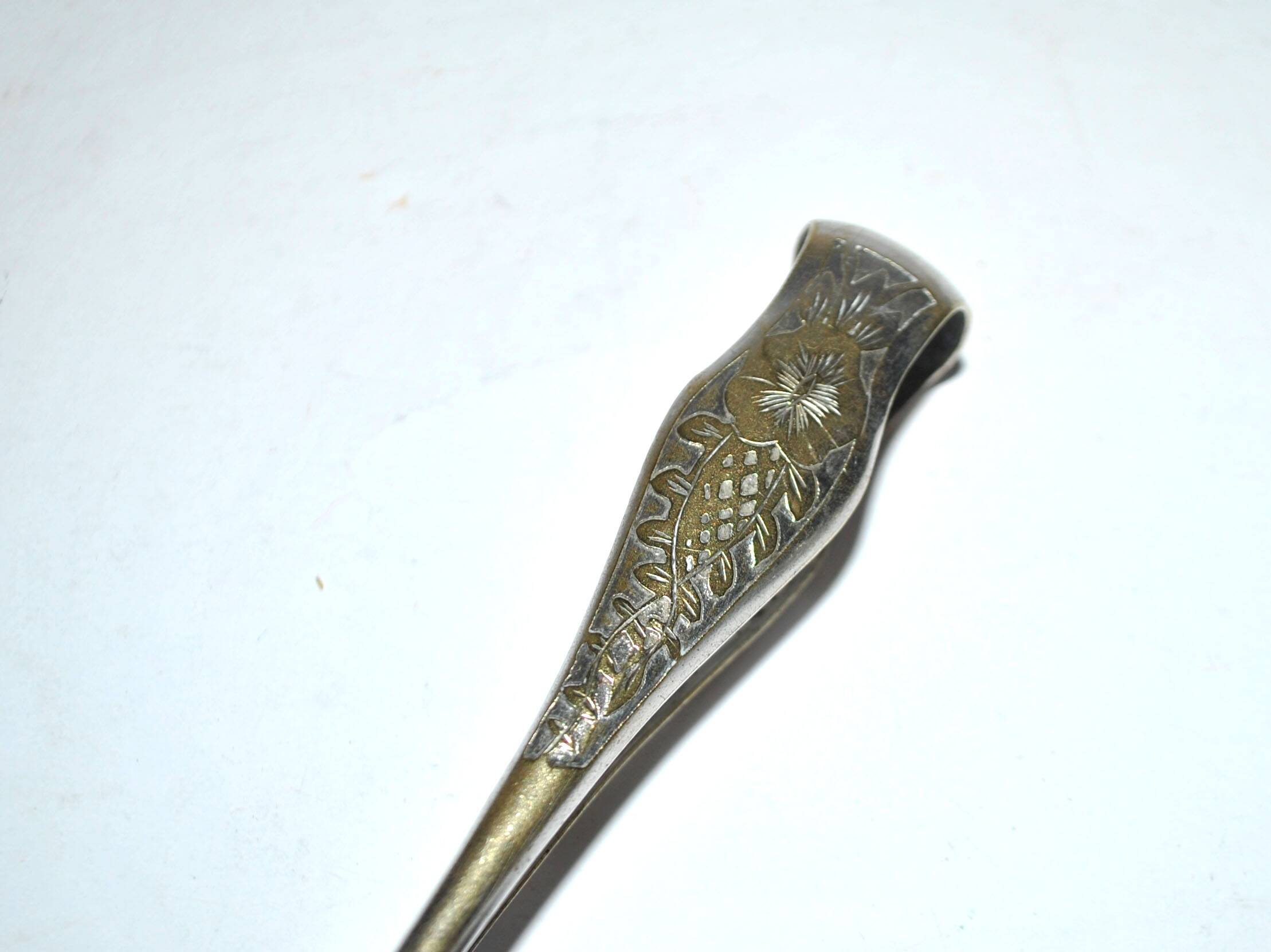 Pince à sucre en métal argenté vintage