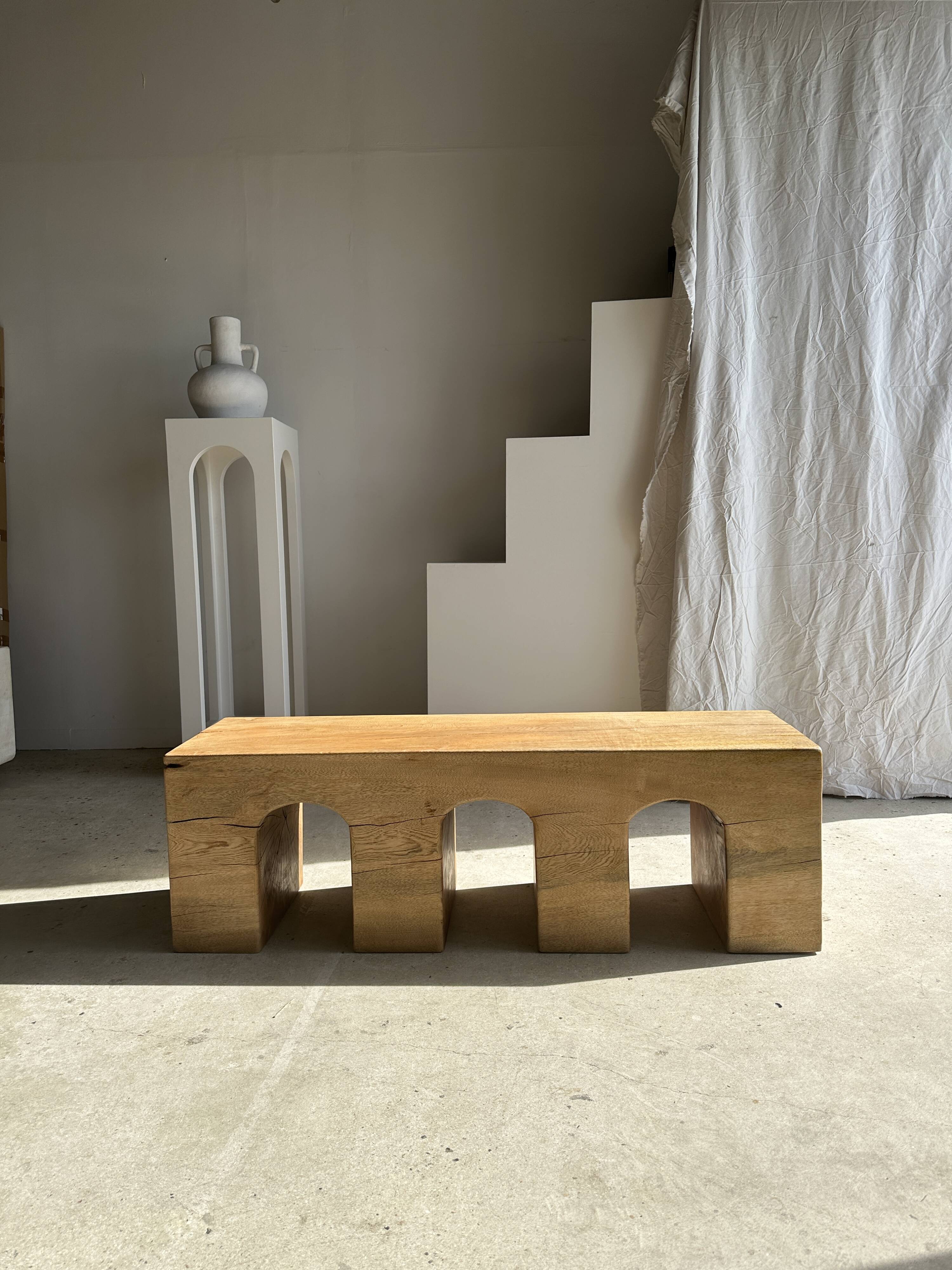 Solid monoxyl wood bench with carved 3-arch base - Natural wood color