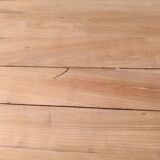 Low farmhouse table in raw wood