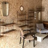 Vintage 1960s mirror in a freeform shape with a gold and red trim.