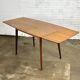 Extendable vintage dining table in teak wood