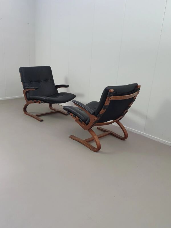 2 x chaises longues scandinaves en cuir noir