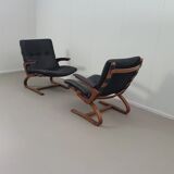 2 x Scandinavian black leather lounge chairs