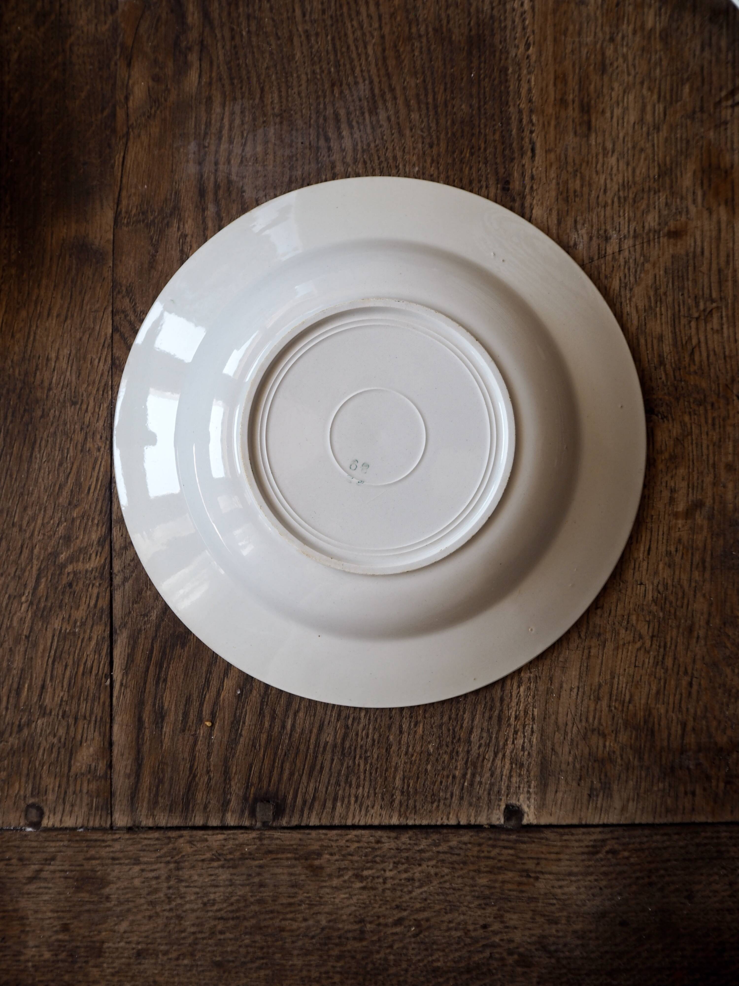 Set of 12 green patterned soup plates, Badonviller earthenware