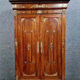 Louis Philippe period wardrobe (nineteenth) entirely covered with gilded bronzes