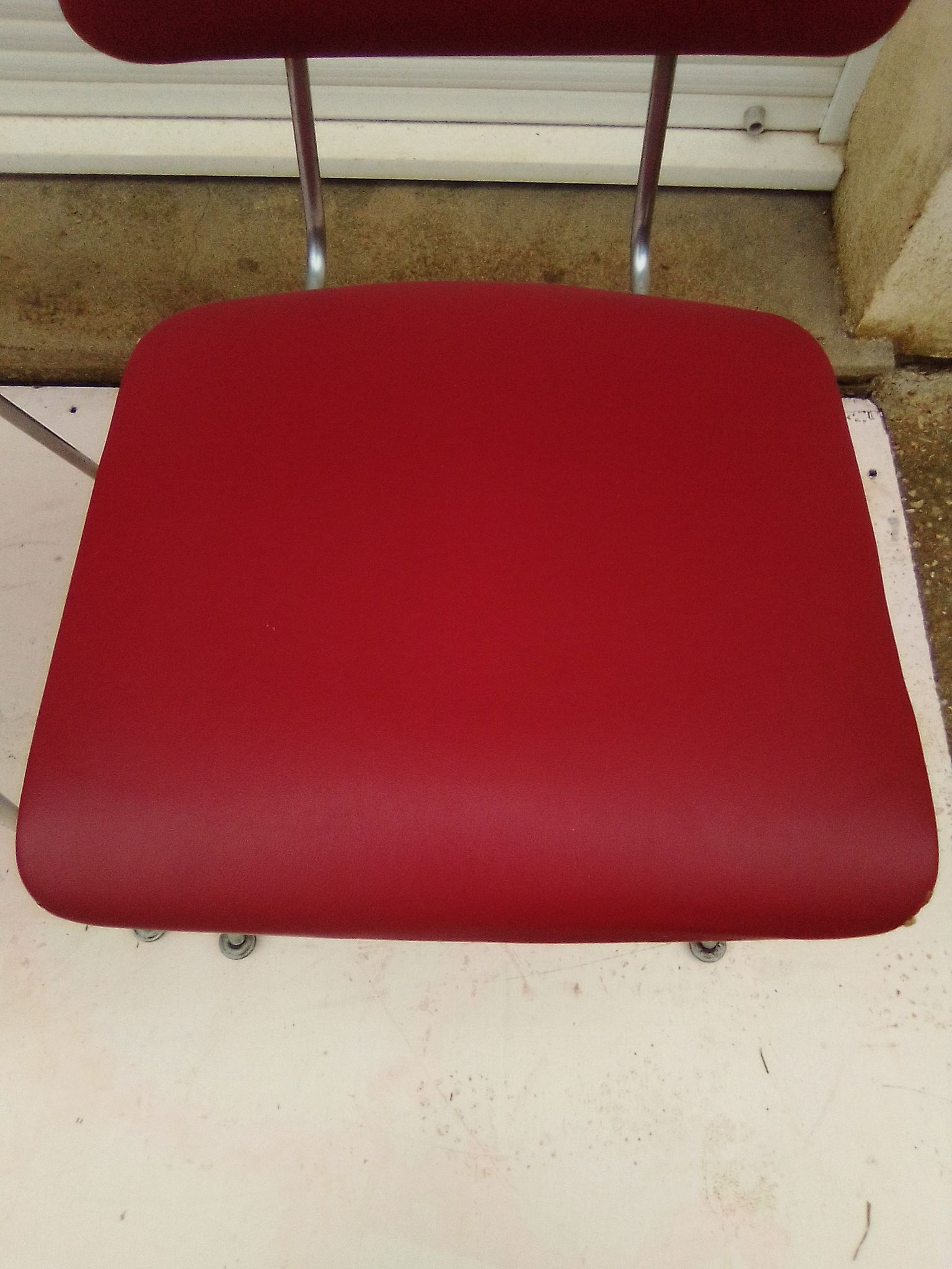2 chairs in red skaï metal struxture 70s