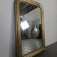 Golden wooden mirror with antique frieze from the Louis Philippe period.