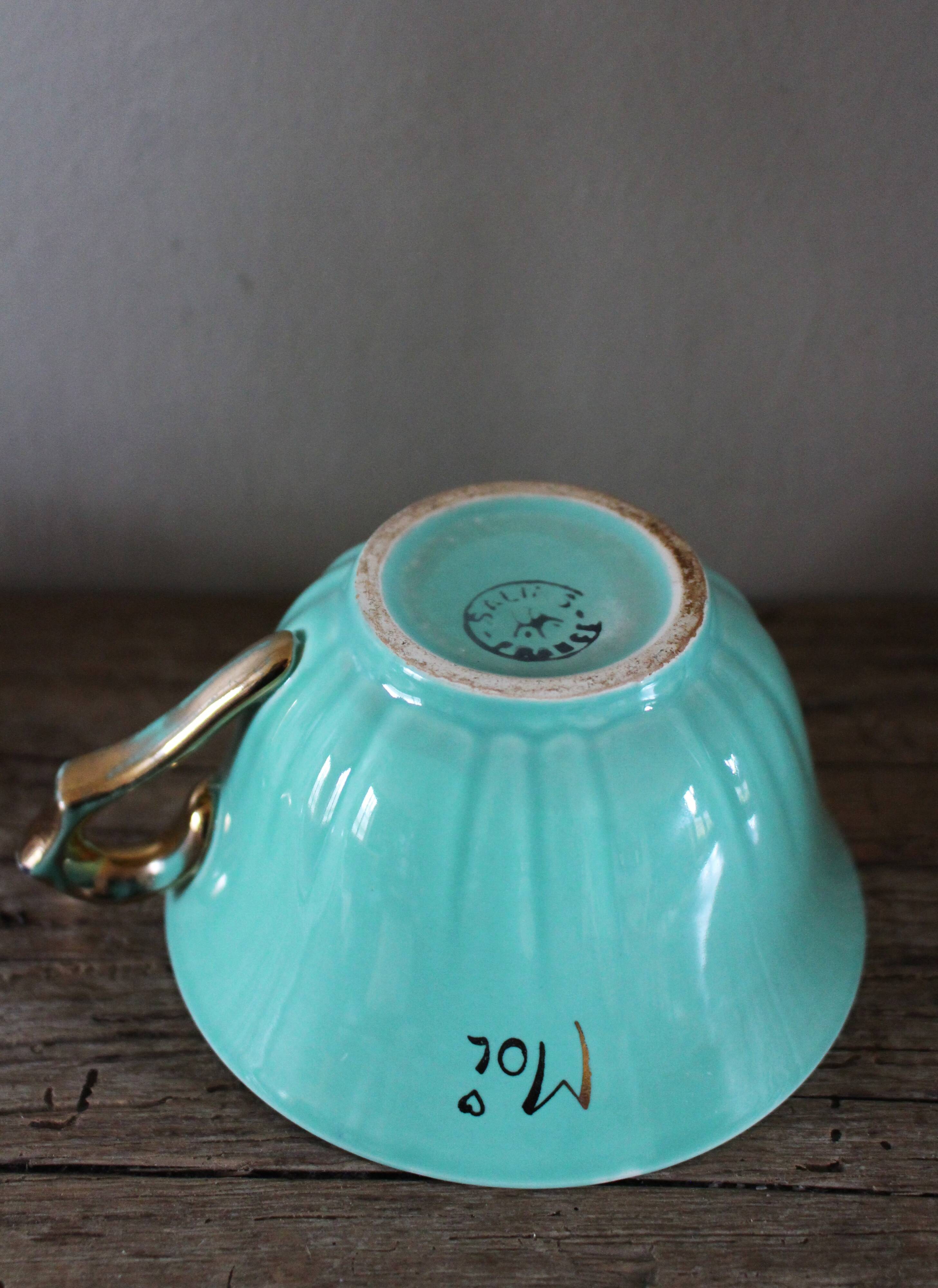 Green and gold cup from the Moi Salins collection.