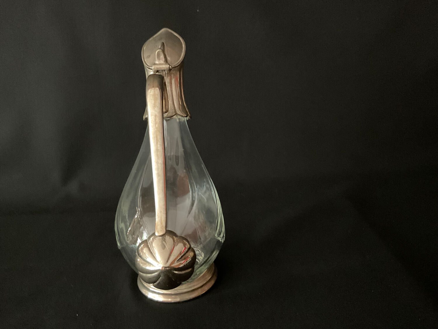 Glass decanter and silver metal duck