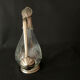 Glass decanter and silver metal duck