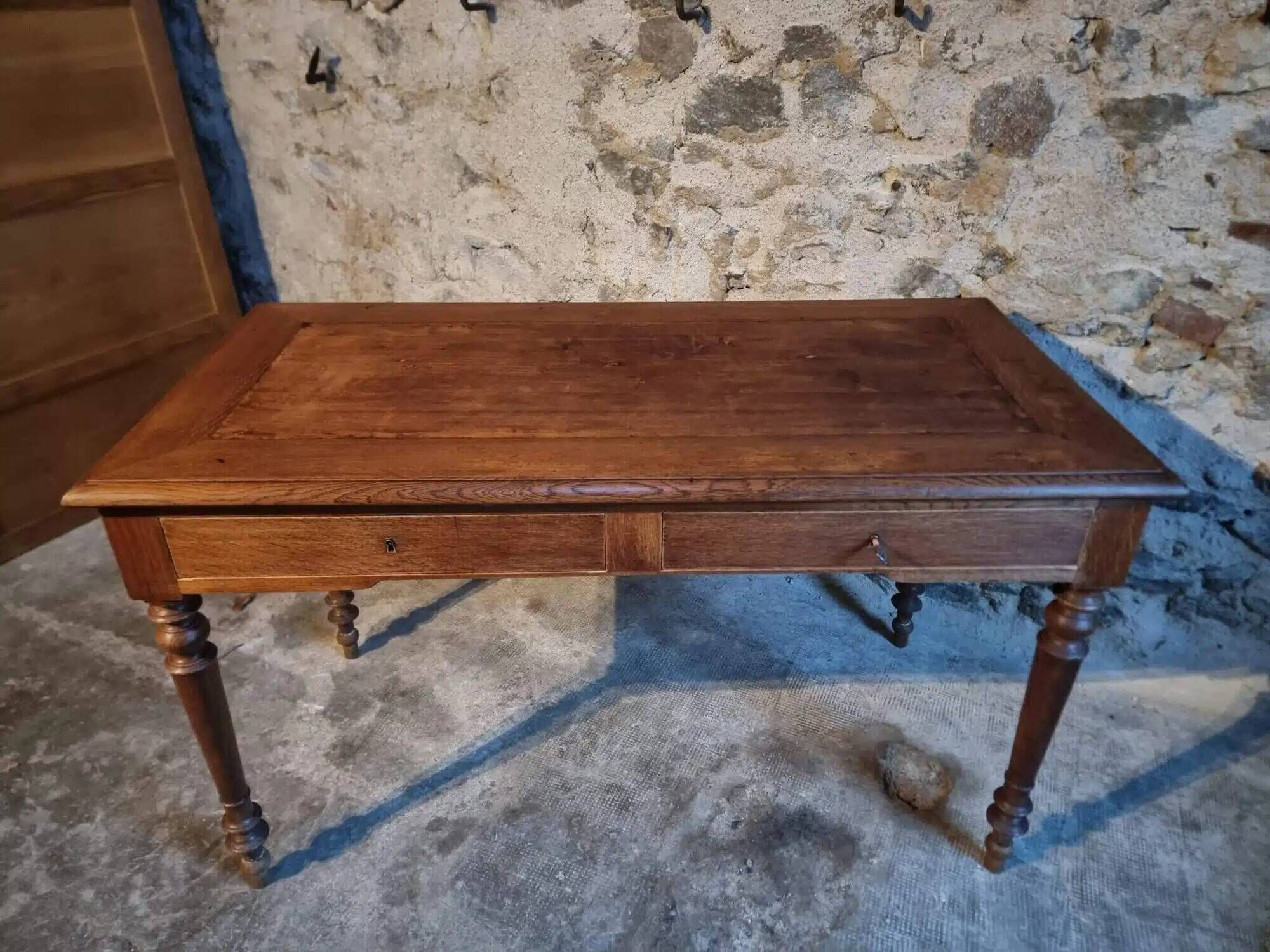 Antique French writing desk in oak with two drawers, 1920s.