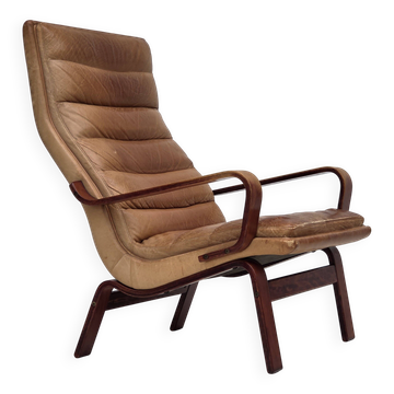 Fauteuil à dossier haut scandinave des années 1970, cuir de meuble, bois cintré.