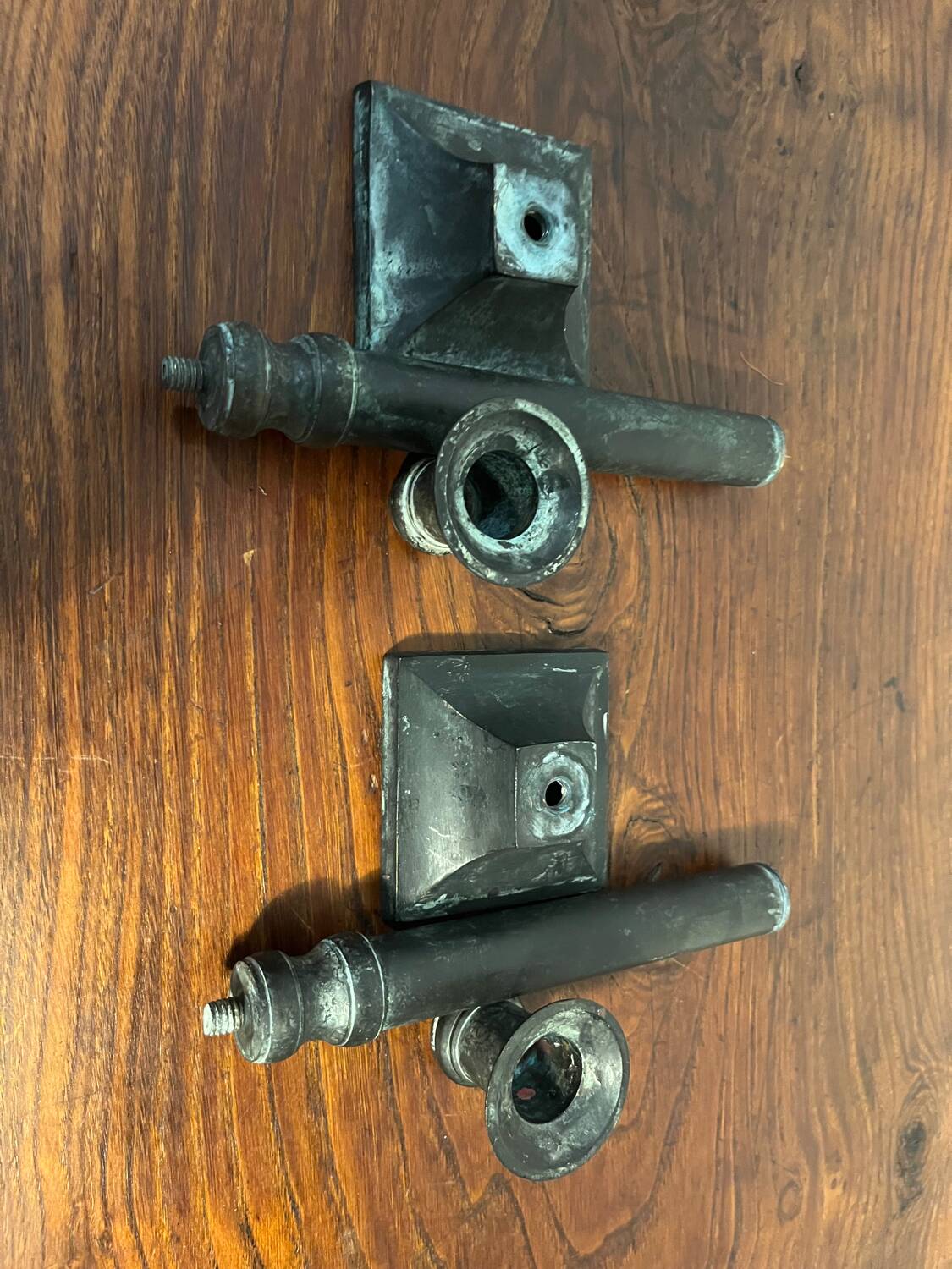 Pair of removable patinated brass candlesticks
