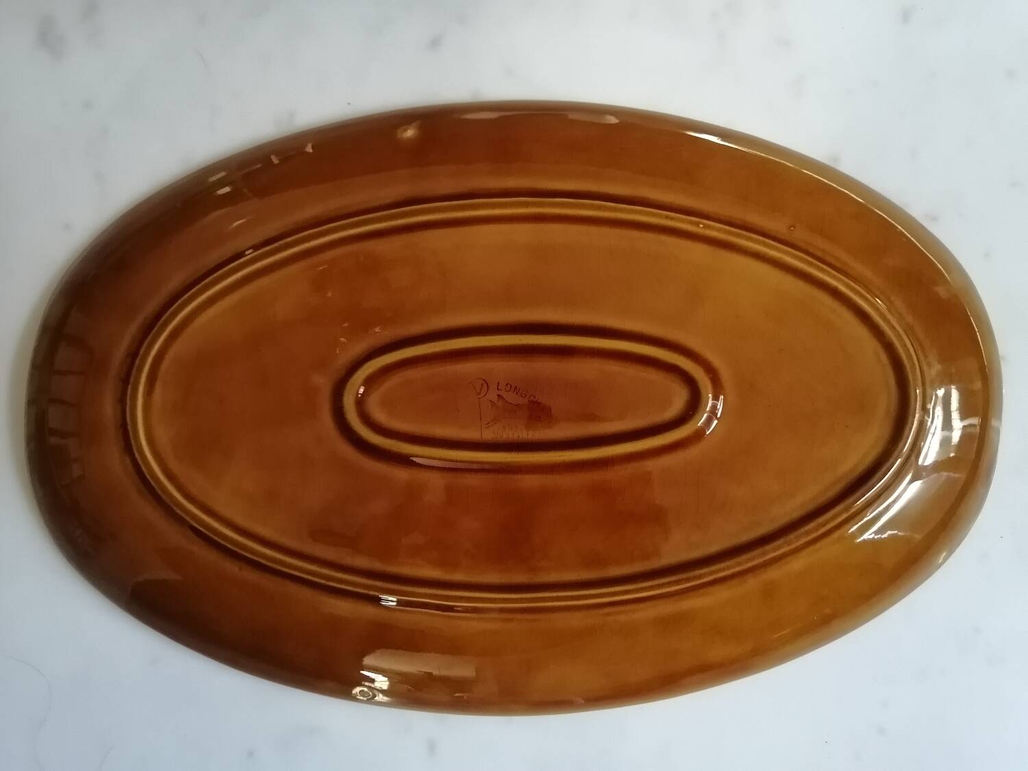 Longchamp dish by Picault
