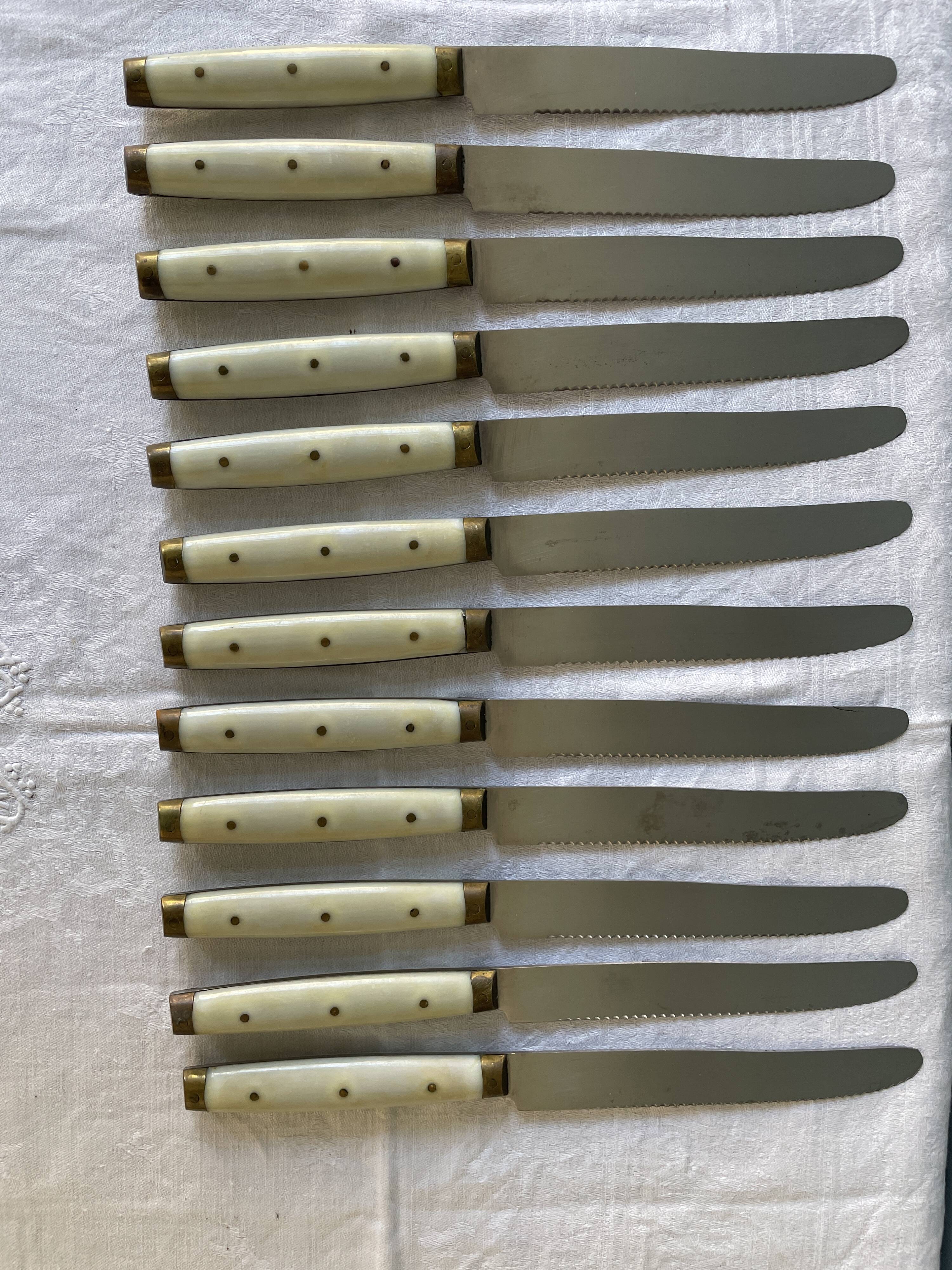 Series of 12 serrated vintage table knives