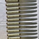 Series of 12 serrated vintage table knives