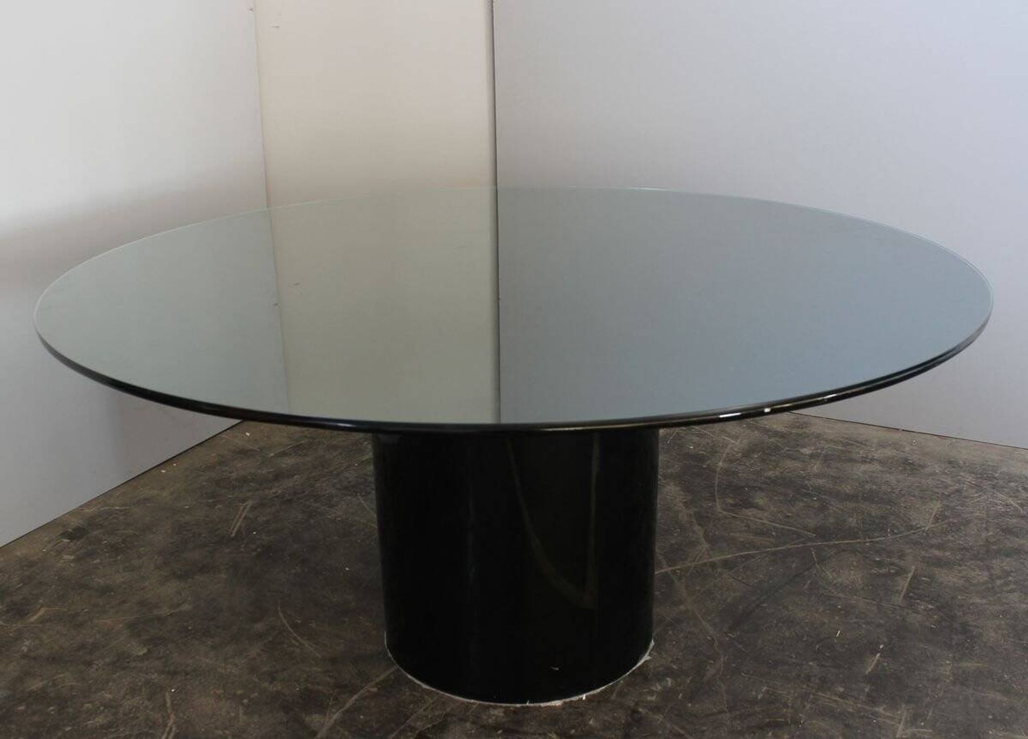 Black lacquered glass table and glass in the hoof style, Italy.