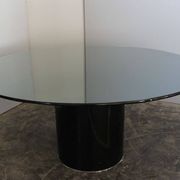 Black lacquered glass table and glass in the hoof style, Italy.