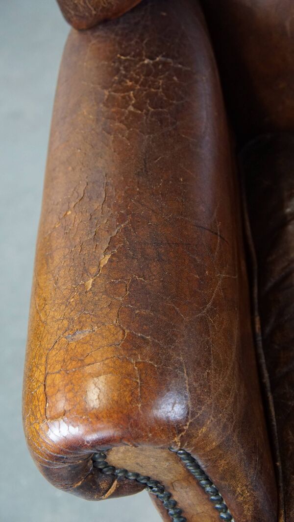 Grand fauteuil à oreilles en cuir de mouton de style anglais vintage