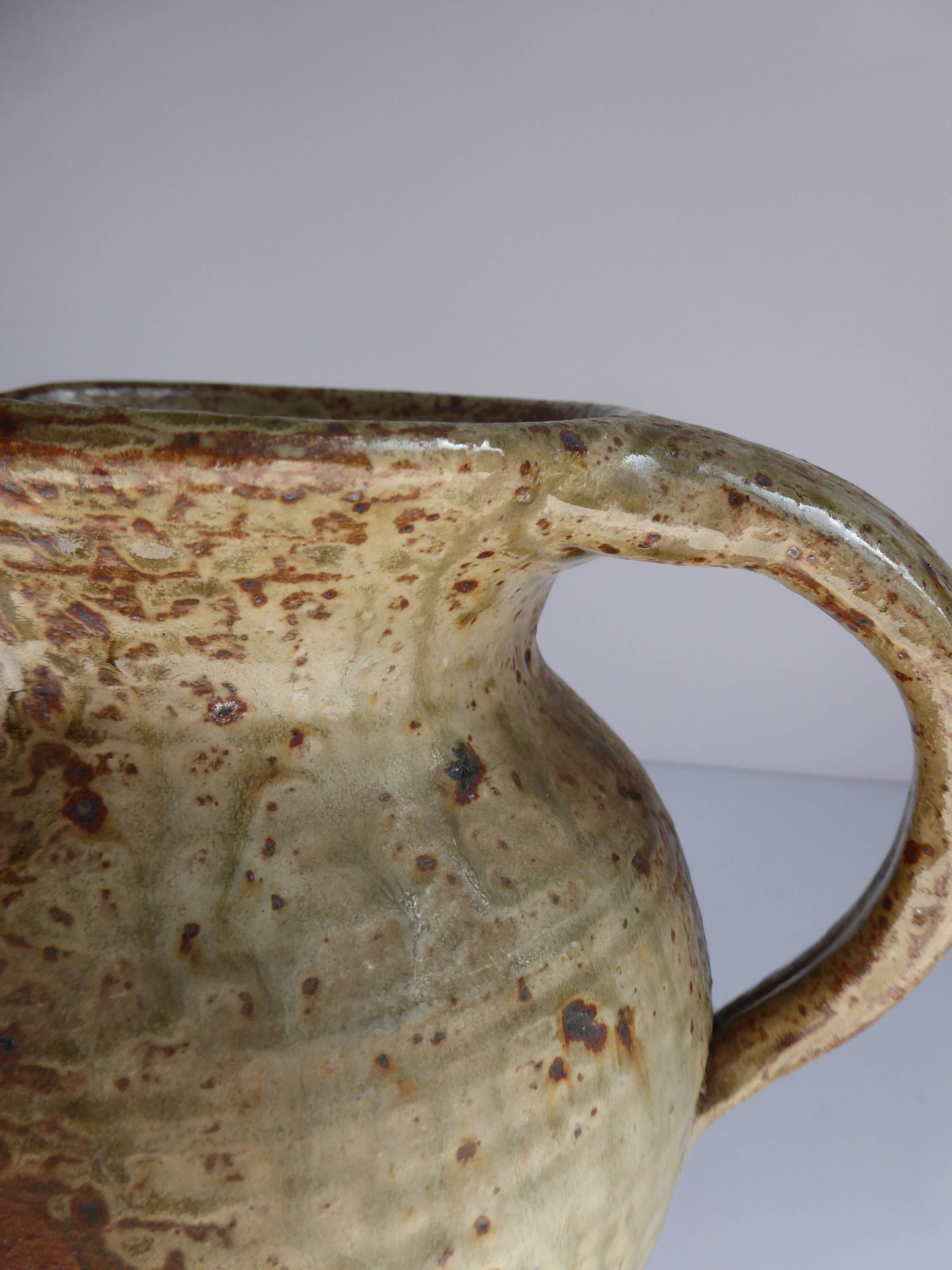 Signed vernissé sandstone pitcher