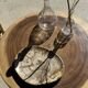 Coffee table in solid suar with central leg and spheres H56.5 D55.5