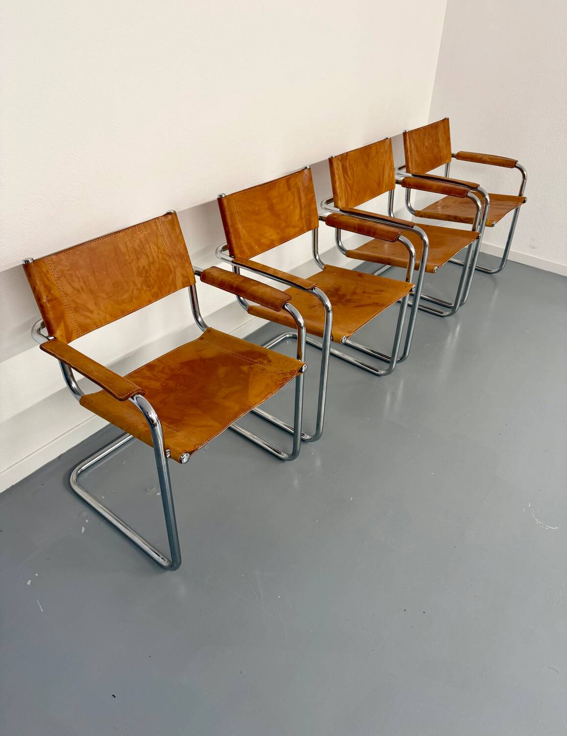 4 vintage tubular chairs with patinated leather designed by Mart Stam