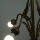 Antique pendant lamp with gold-coloured and ornate details and 3 fittings