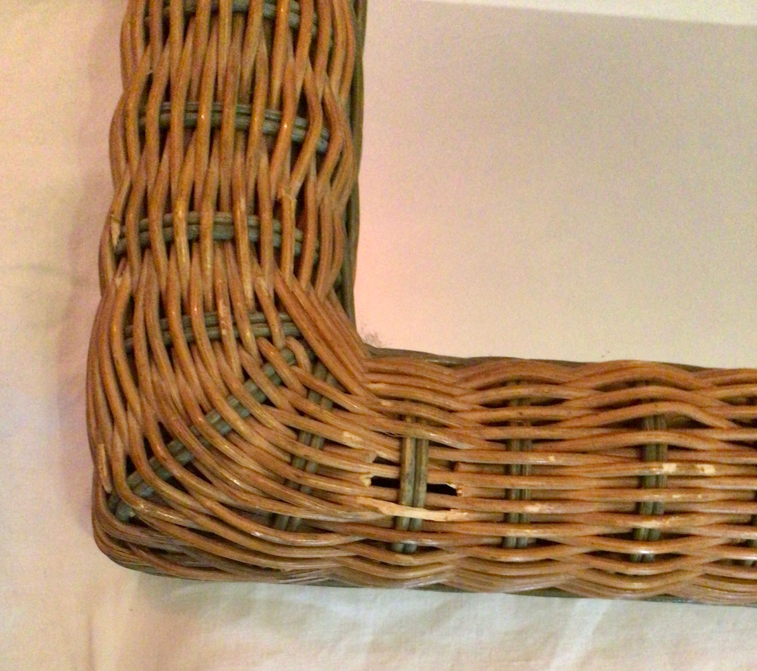 Vintage braided rattan mirror.