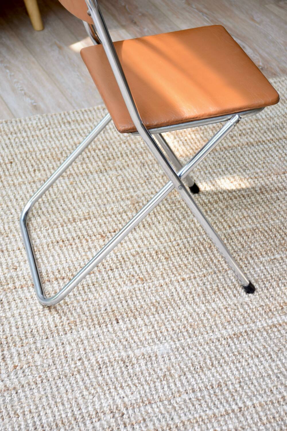 Pair of “Soudexvinyl” folding chairs in skai and chrome tube