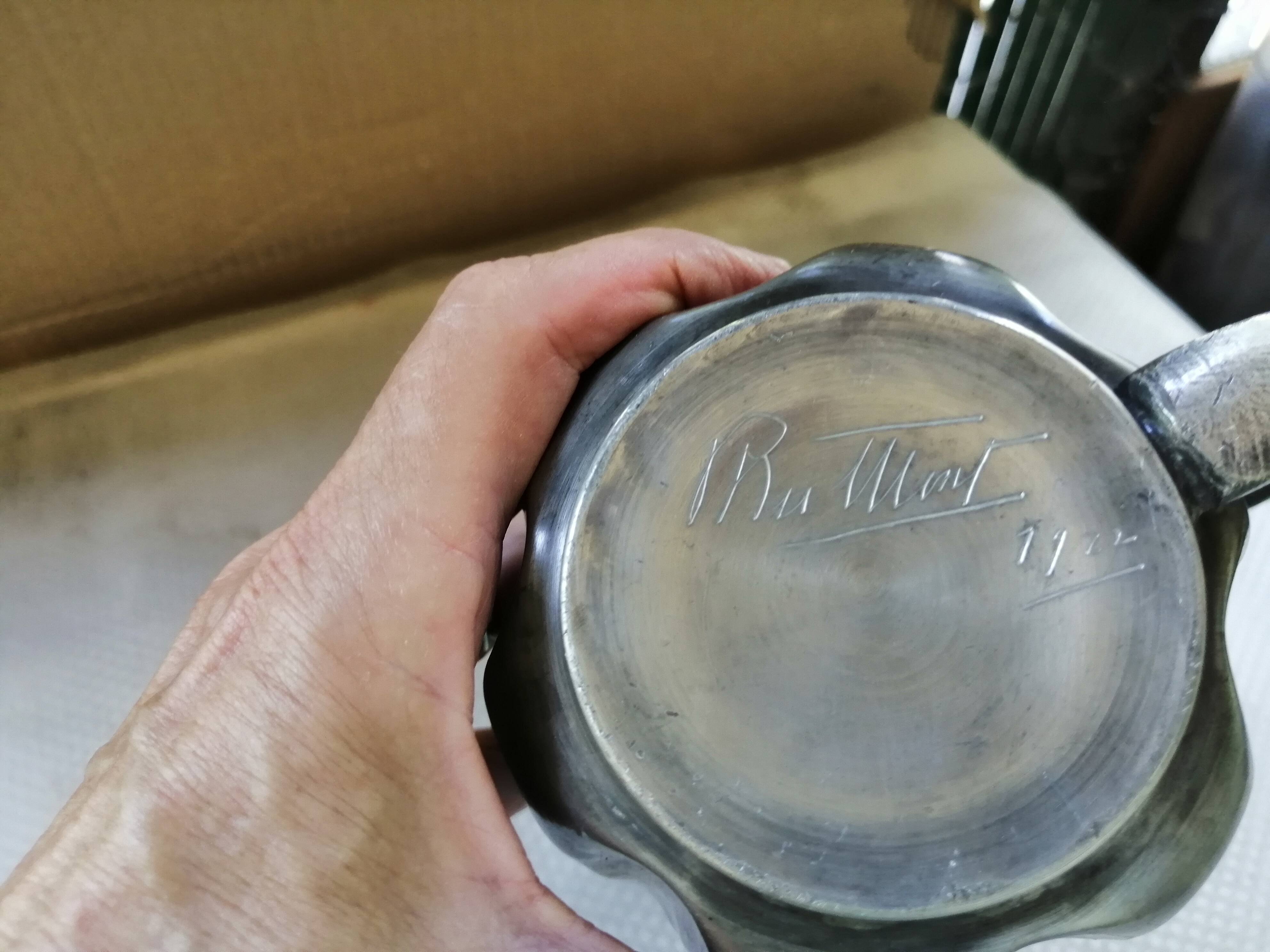 Tin pitcher signed and dated 1922