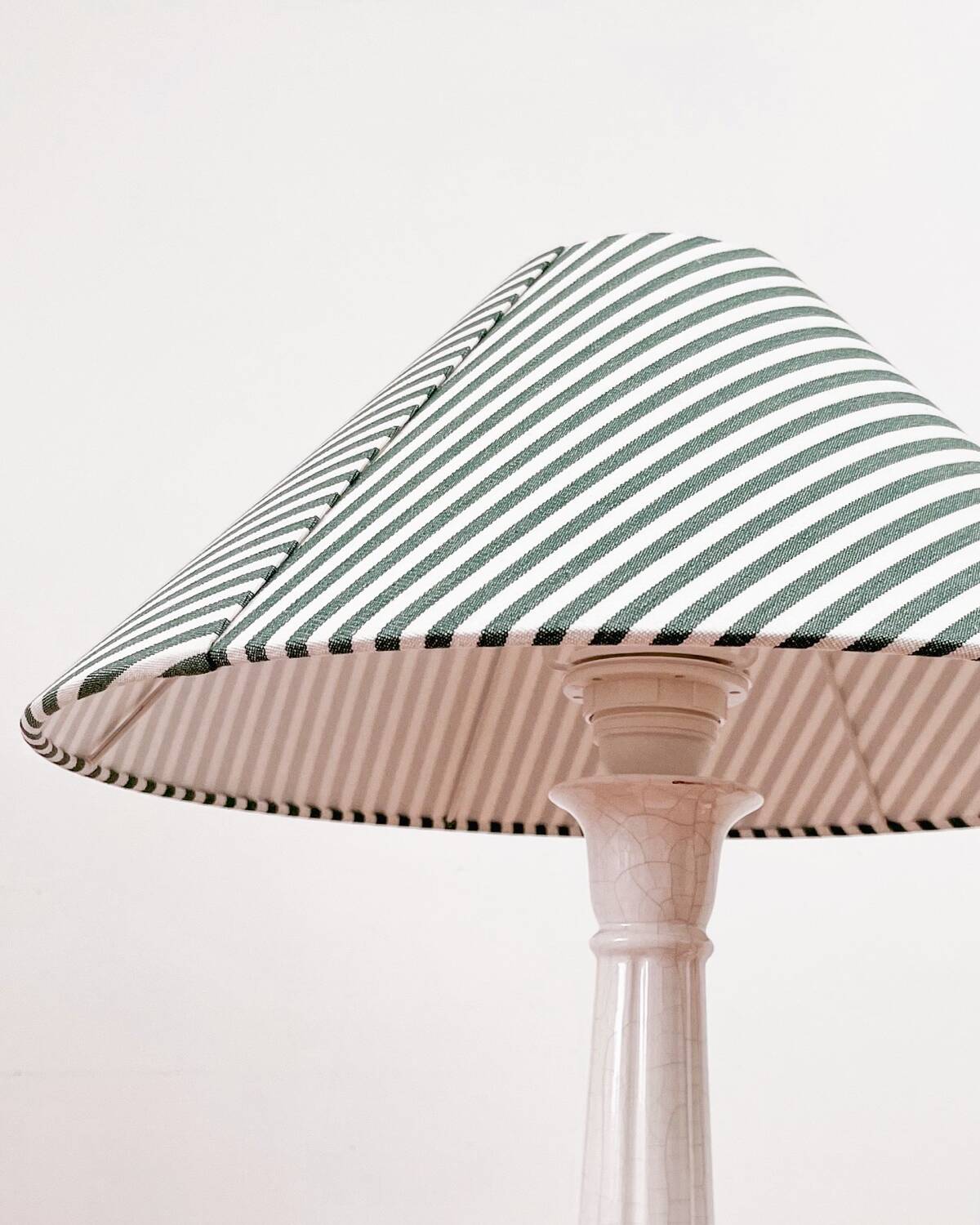 Earthenware lamp and striped lampshade