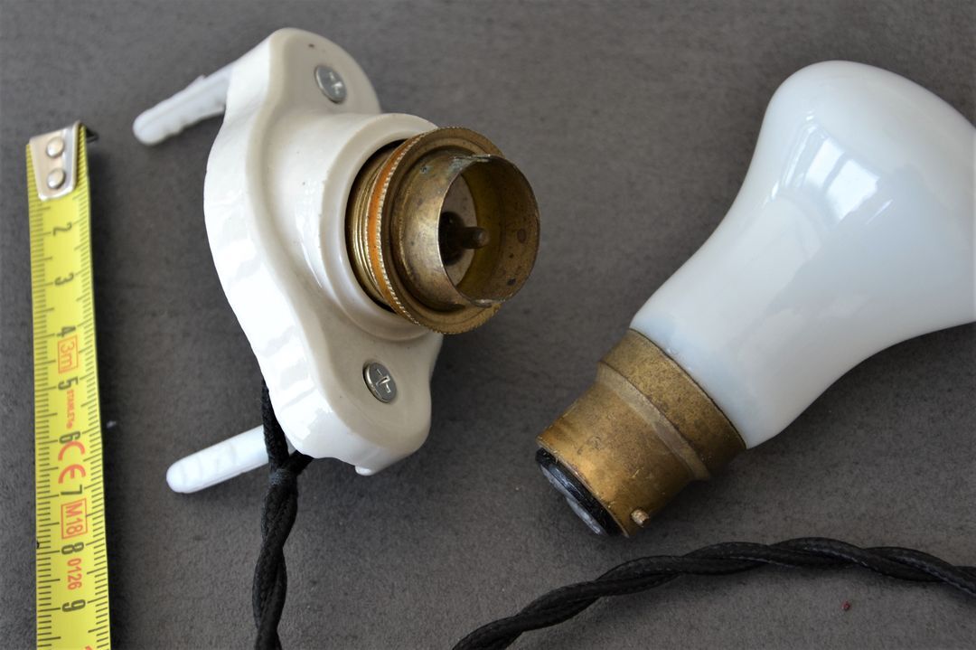 Oval porcelain hook to plug into socket