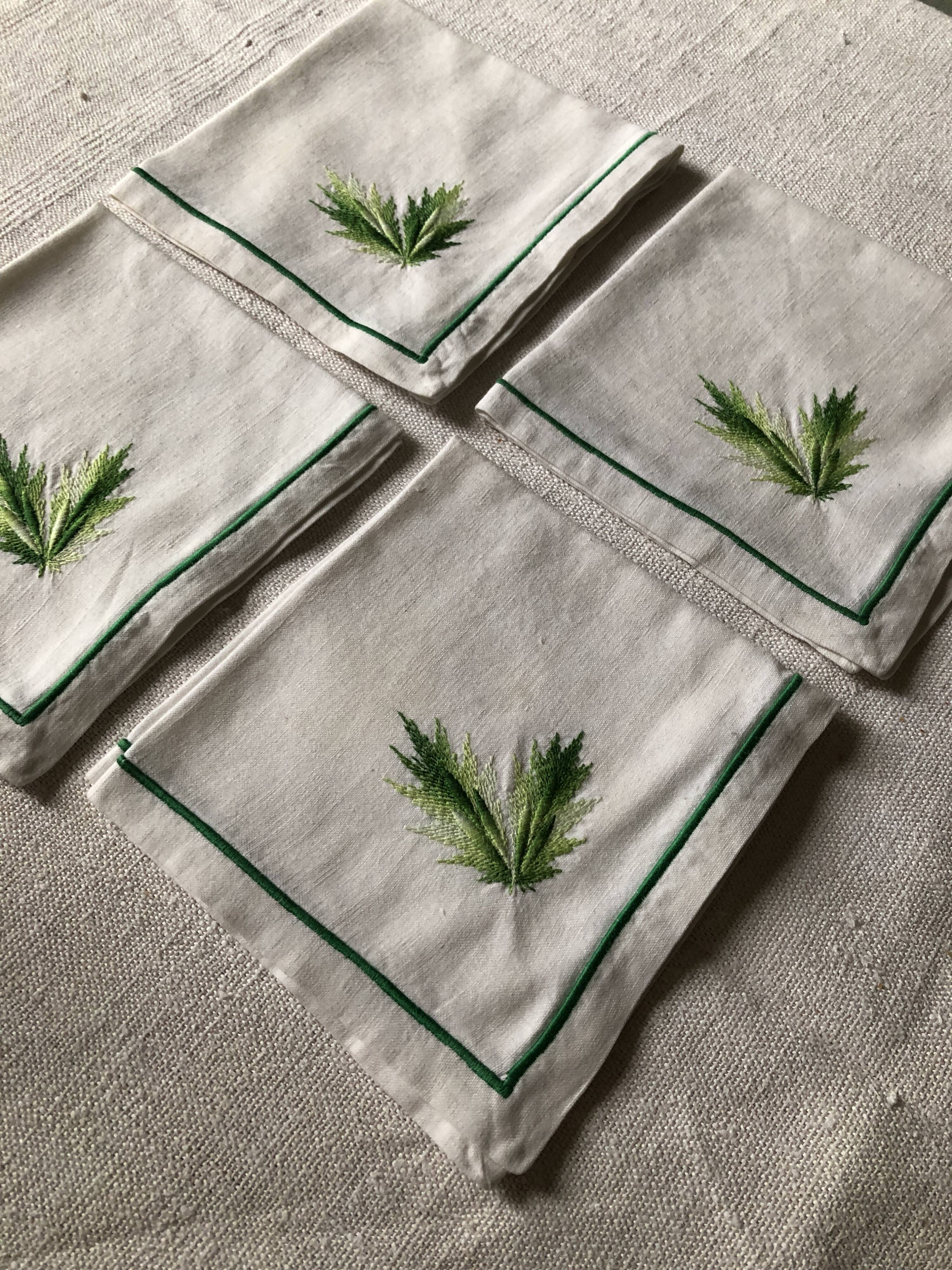Series of four embroidered linen napkins