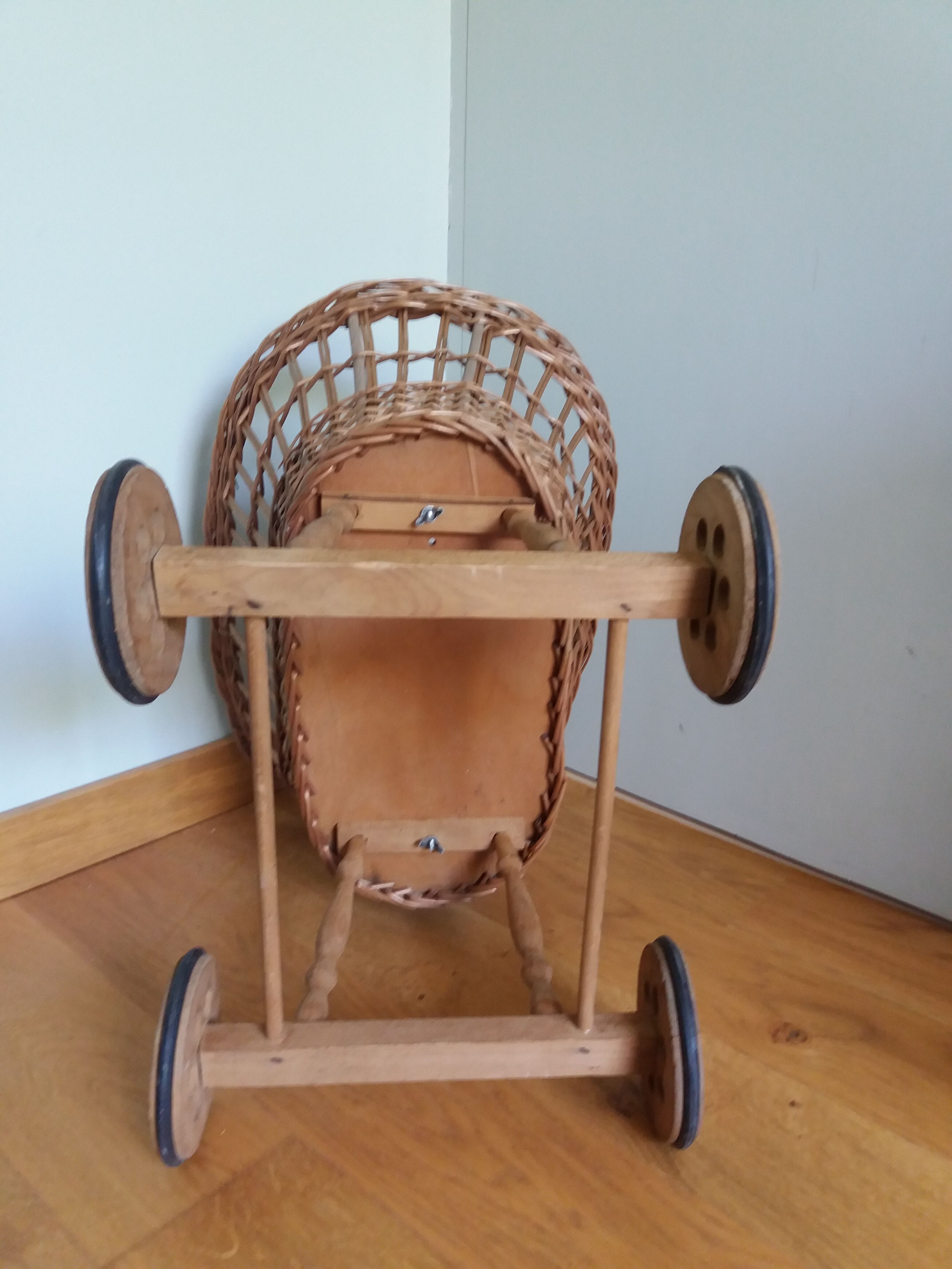 Wicker rattan doll cradle with wheels