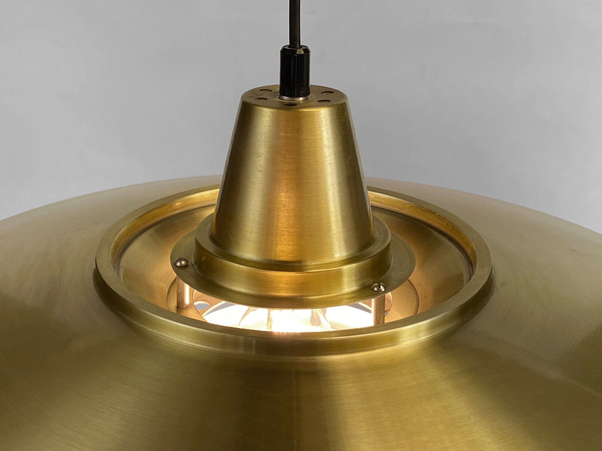 Large brushed aluminum pendant light with golden finish. Produced by Jeka. Denmark 1970s